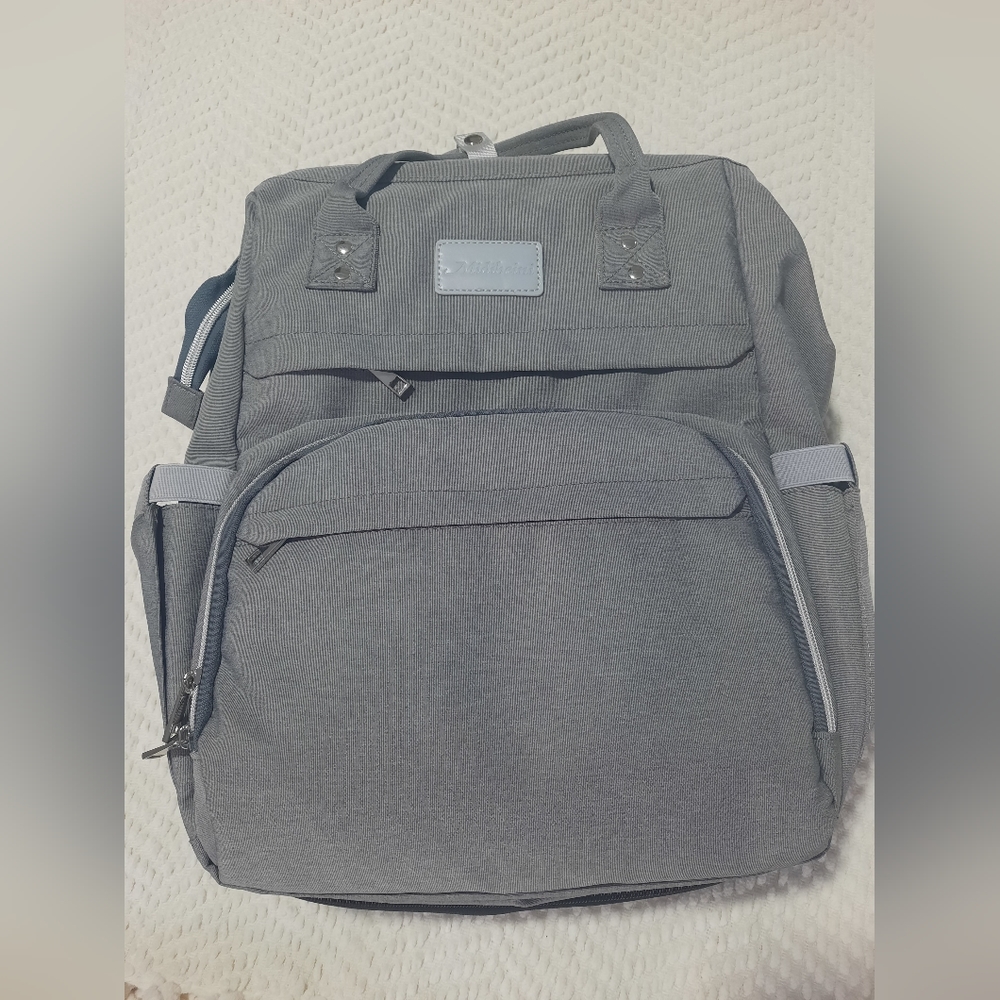 Midibeini Diaper Bag / backpack with built in changing station and mosquito net.